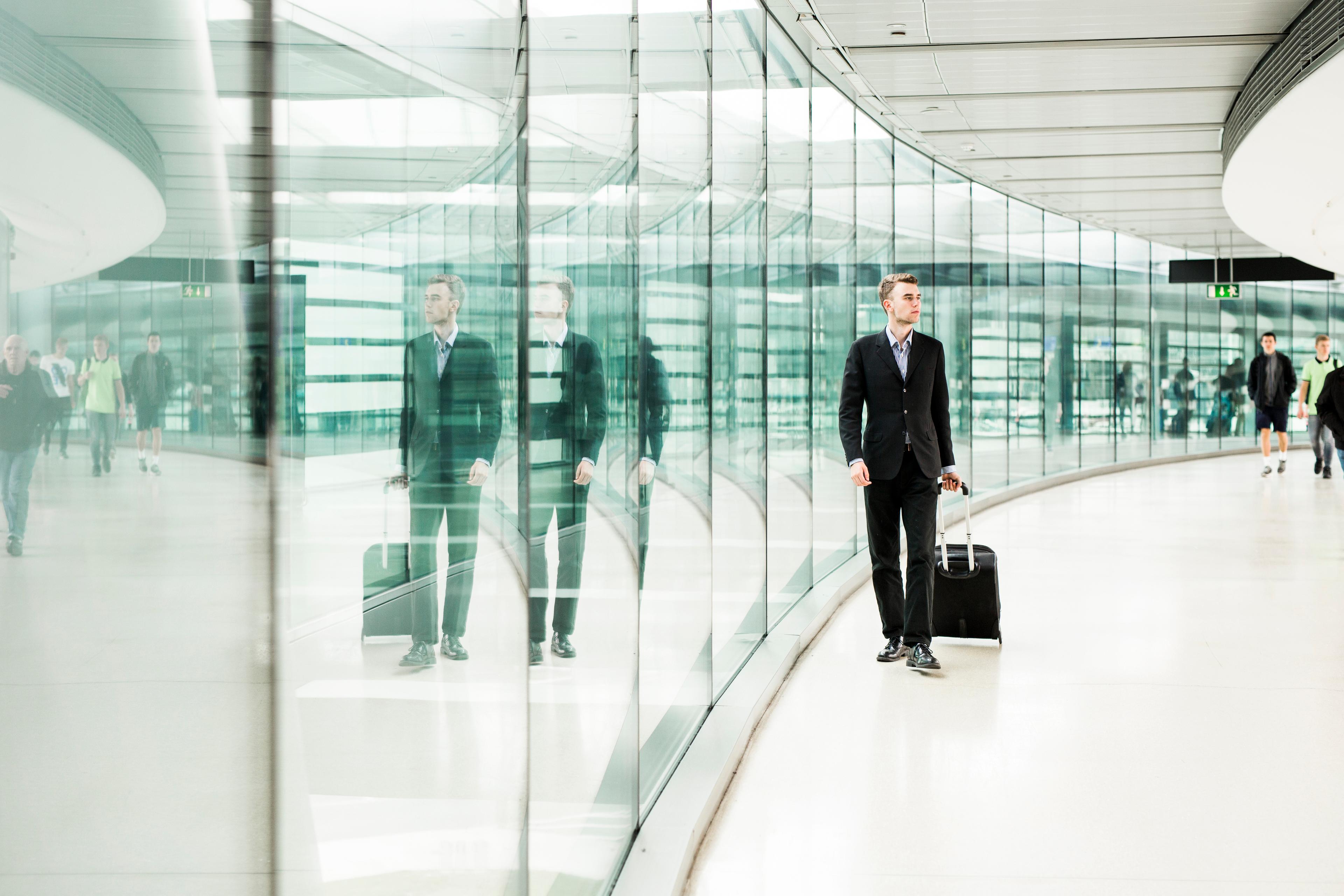 Businessman walking at the airport during a tight connection