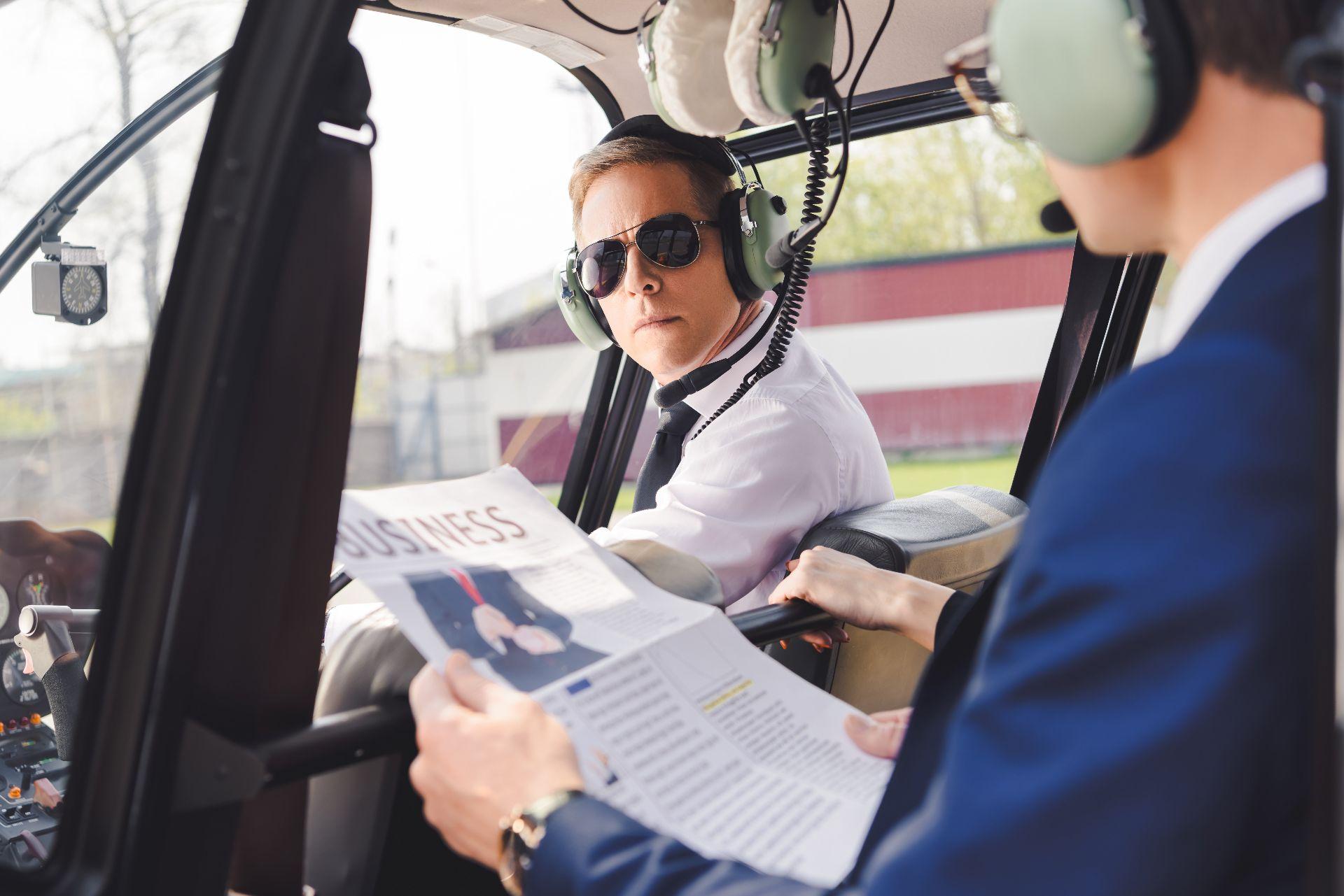 Business executive focused and productive inside a private helicopter cabin
