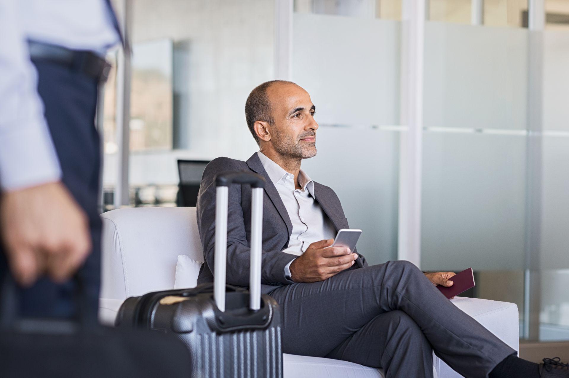 Executive boarding aircraft calmly while others queue, thanks to fast track service